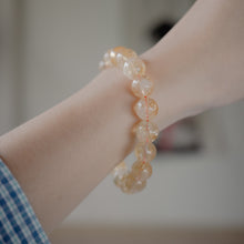 Load image into Gallery viewer, Natural Citrine Bracelet with beautiful yellow color. Everyone piece is unique. Best gift for your best friend/ BFF, birthday gift, Valantine&#39;s day gift and daily wear. 天然黃水晶手鏈， 每一條都是獨一無二深紫色色彩，黃水晶能提升財富運，感壓力及令人平和的力量，最佳的節日禮物，閨蜜禮物，生日及情人節禮物。彈力線設計，可調節長度，簡單易佩搭，適合經常配戴。
