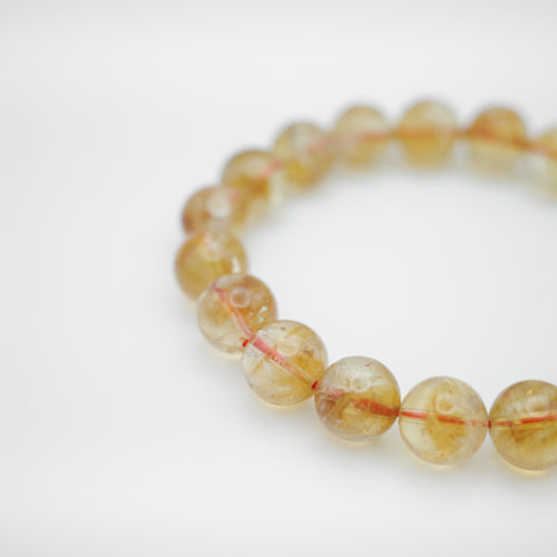 Natural Citrine Bracelet with beautiful yellow color. Everyone piece is unique. Best gift for your best friend/ BFF, birthday gift, Valantine's day gift and daily wear. 天然黃水晶手鏈， 每一條都是獨一無二深紫色色彩，黃水晶能提升財富運，感壓力及令人平和的力量，最佳的節日禮物，閨蜜禮物，生日及情人節禮物。彈力線設計，可調節長度，簡單易佩搭，適合經常配戴。