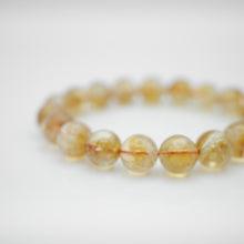 Load image into Gallery viewer, Natural Citrine Bracelet with beautiful yellow color. Everyone piece is unique. Best gift for your best friend/ BFF, birthday gift, Valantine&#39;s day gift and daily wear. 天然黃水晶手鏈， 每一條都是獨一無二深紫色色彩，黃水晶能提升財富運，感壓力及令人平和的力量，最佳的節日禮物，閨蜜禮物，生日及情人節禮物。彈力線設計，可調節長度，簡單易佩搭，適合經常配戴。
