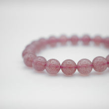 Load image into Gallery viewer, Beautiful Strawberry Quartz Bracelet with shinny pink color. Everyone piece is unique. Best gift for your best friend/ BFF, birthday gift, valantine&#39;s day gift and daily wear. 天然草莓晶手鏈， 每一條都是獨一無二，草莓晶能提升愛情運，最佳的告白禮物，閨蜜禮物，生日及情人節禮物。彈力線設計，可調節長度，簡單易佩搭，適合日常配戴。
