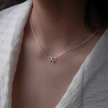 Load image into Gallery viewer, Wearing Ginkawa bow necklace with adjustable extension chain. Unique necklace, best gift for anniversary, mother&#39;s day, birthday, BFF. Cute design and easy for daily wearing nature style. 925 純銀蝴蝶結項鏈，可愛風格，簡約好搭配，閨蜜禮物，姊妹聚會配件，母親節禮物，七夕情人節禮物，經典百搭款式。
