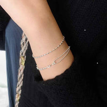 Load image into Gallery viewer, 佩戴925 純銀小雨點手鏈 Wearing Ginkawa Cute raindrop bracelet in 925 Sterling Silver. Basic bracelet which can mix and match all of your daily dress.
